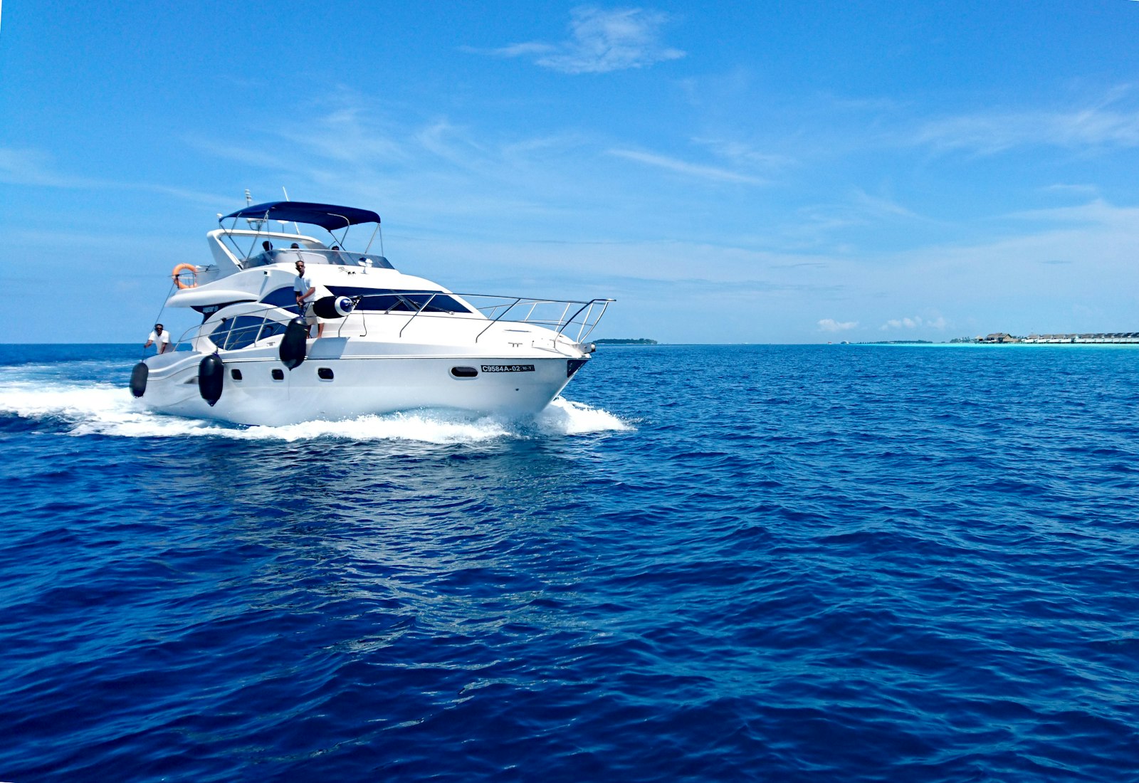 Motor yacht cruising across open coastal waters